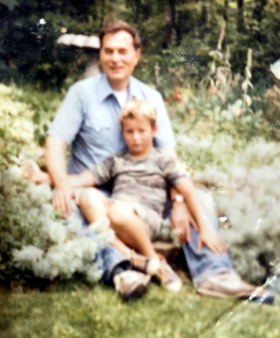 Robert Logan Bull with Robert Alan Bull in his lap.