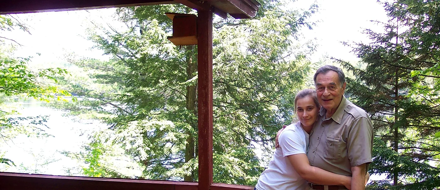 Laura Jean Bull with Robert Logan Bull on the side deck at the Lodge.