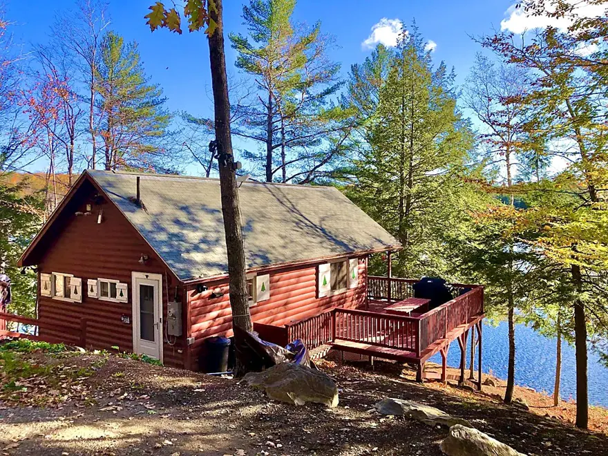 The Guest Lodge seen across Santa Claus Lake in autumn